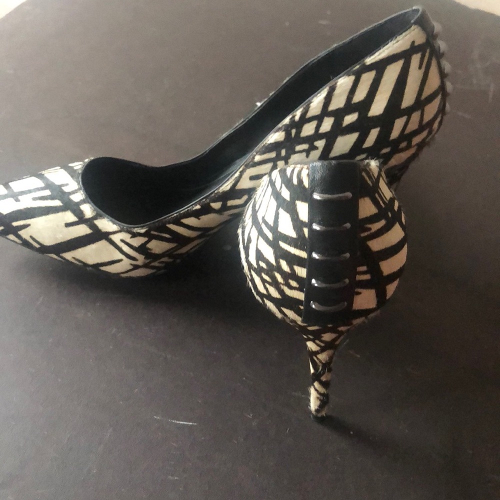 Black and white low haired shoes
